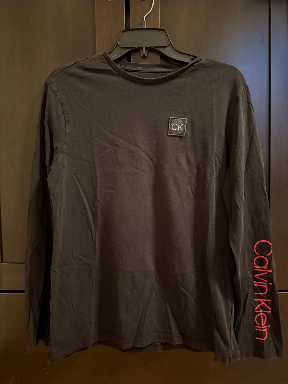 CALVIN KLEIN Black Long Sleeve Tee with Red Sleeve Branding